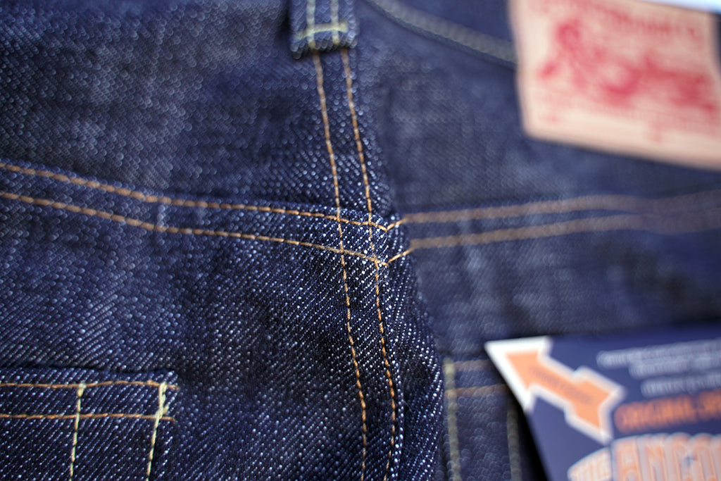 Macro view of Ancoblack 4700xx back pocket arcs with vintage cotton thread chainstitching