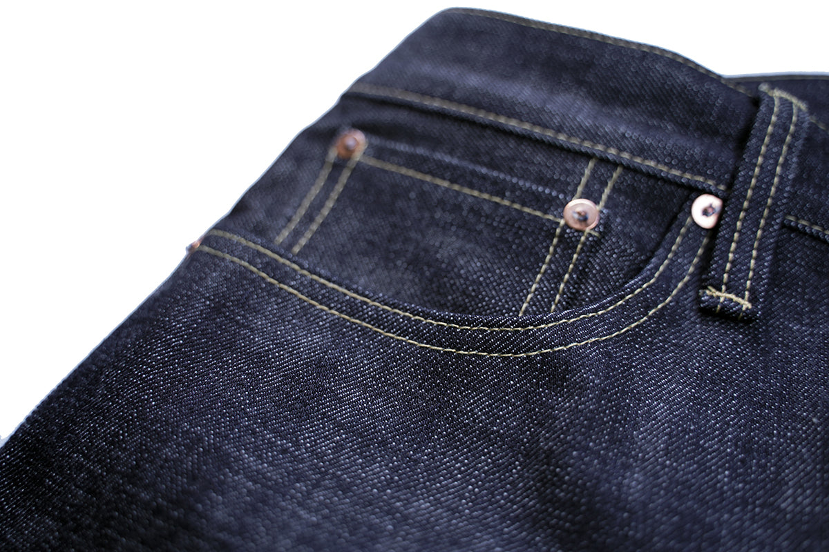 Ancoblack 4700xx front coin pocket detail with solid copper rivets on raw selvedge jeans