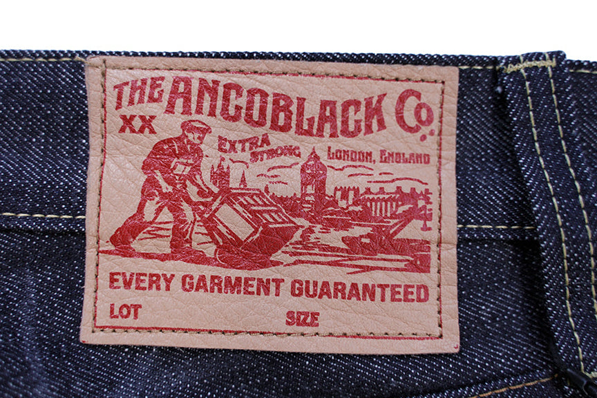 Ancoblack vintage style stamped leather patch on waist of 14oz raw selvedge denim jeans